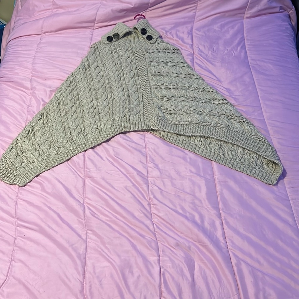 Beige thick shrug esque with turtle neck and cute design